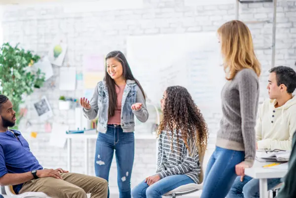 five students engage in a leadership development meeting