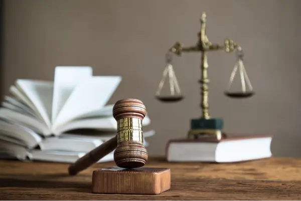 a gavel and scale that embodies legal considerations for student life professionals