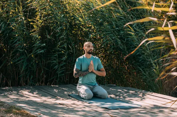 A person meditating embodying the importance of post-election self-care for educators